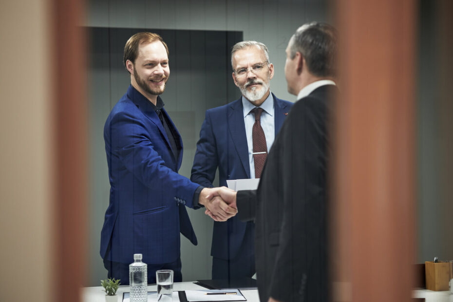corporate attorney los angeles boardroom settlement handshake