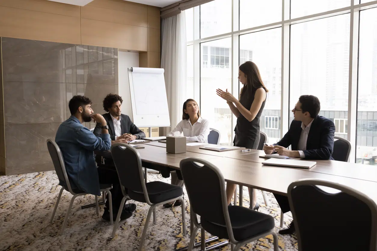 Serious corporate professionals in an executive boardroom representing California asset protection defense