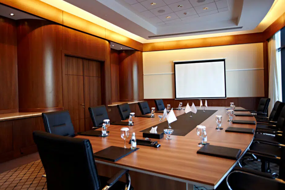 California business dispute lawyer reviewing litigation hold requirements in a corporate conference room.