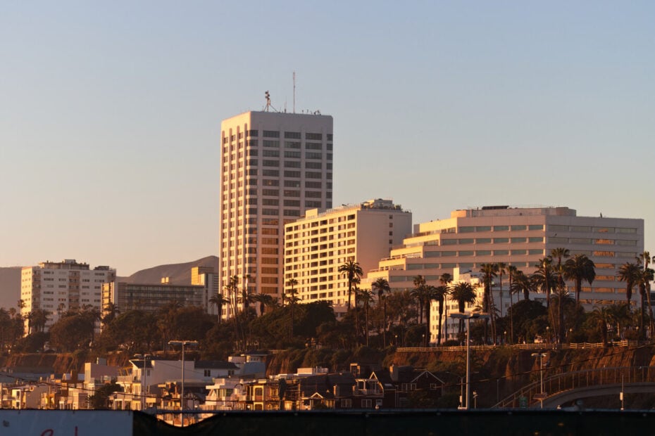 Commercial lease dispute lawyer Santa Monica skyline office buildings at sunset.