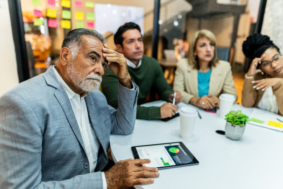 Injunction lawyer for business disputes discussing a corporate deadlock with business partners.
