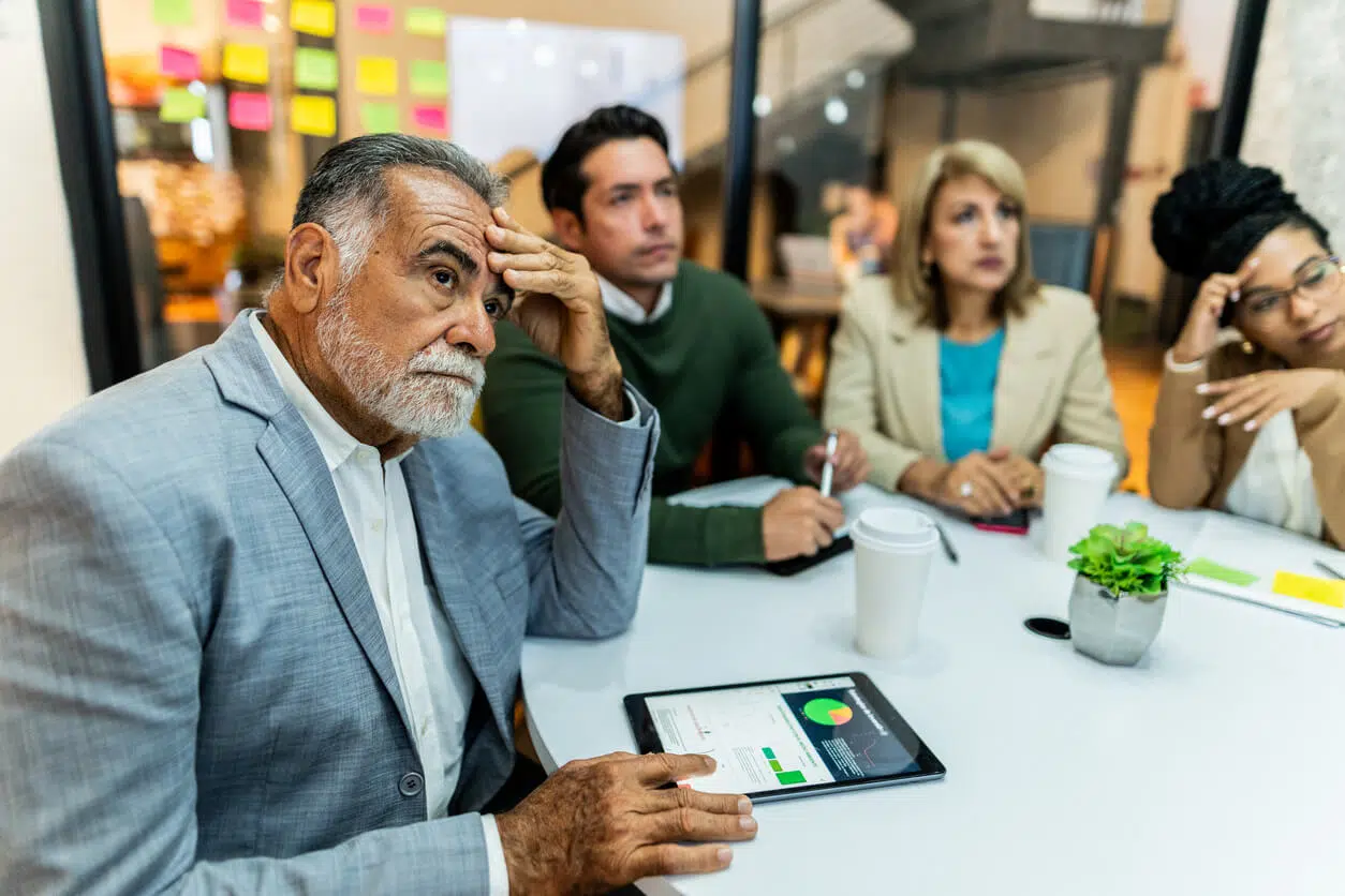 Injunction lawyer for business disputes discussing a corporate deadlock with business partners.