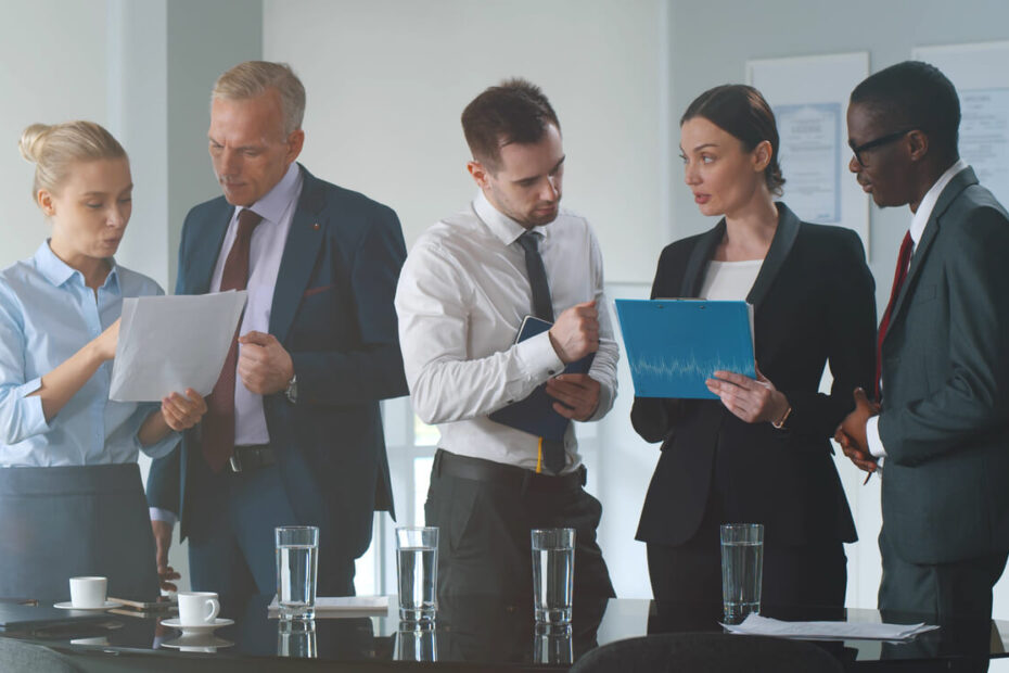 Corporate officers and legal counsel preparing financial documents for a Person Most Knowledgeable deposition under California