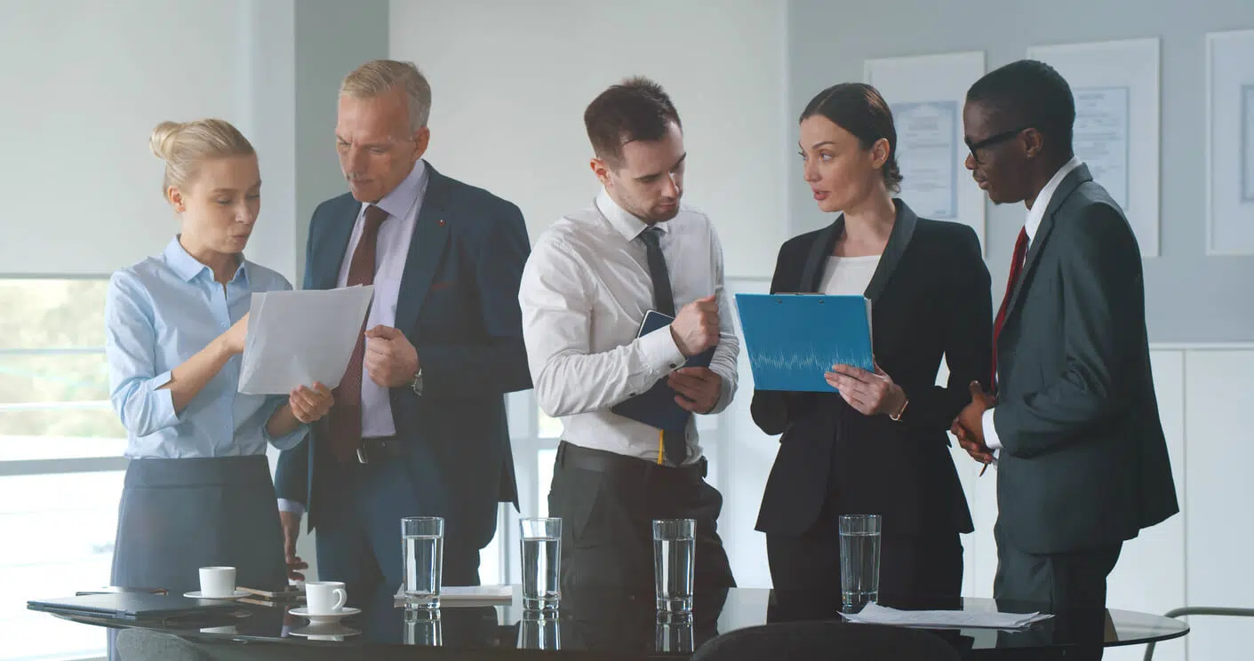 Corporate officers and legal counsel preparing financial documents for a Person Most Knowledgeable deposition under California