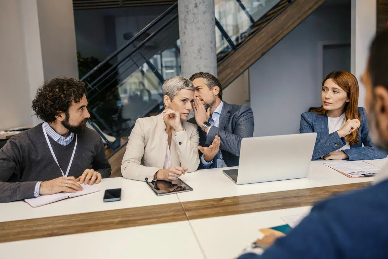 Corporate board members consulting an attorney during a California commercial financing contract dispute.