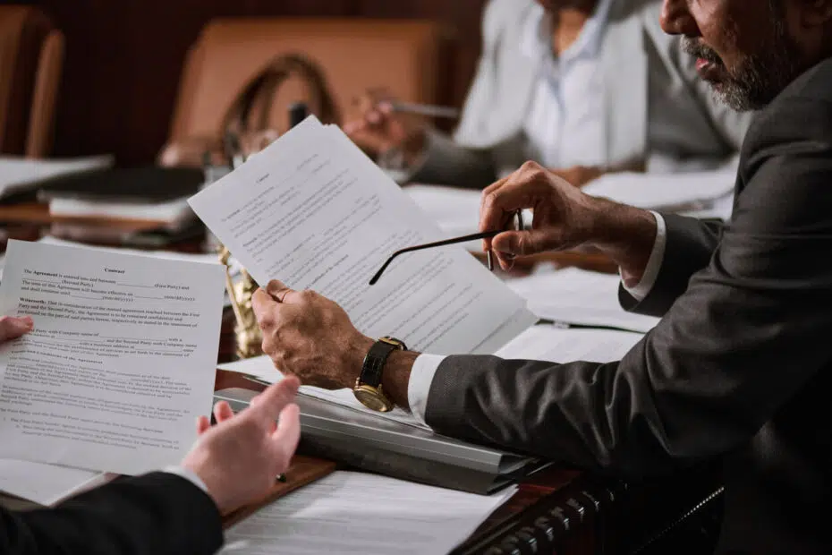 Santa Monica business litigation attorney reviewing a corporate contract dispute in an office workplace.